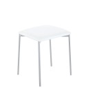 Taburete bajo Inaya con estructura de acero gris y asiento acolchado en PVC blanco, diseño moderno y confortable.