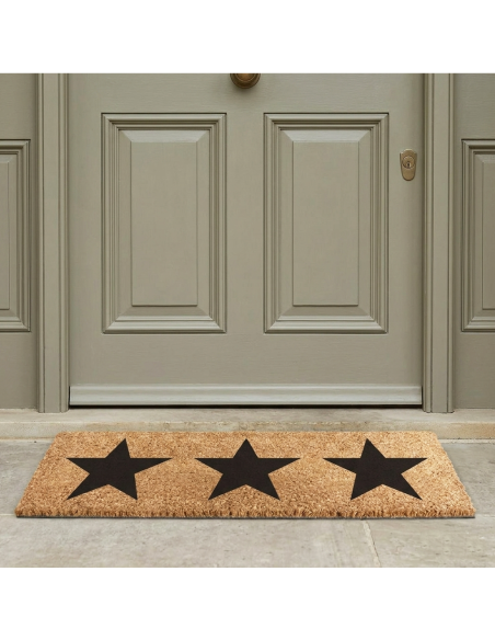 felpudo de coco con estrellas negras